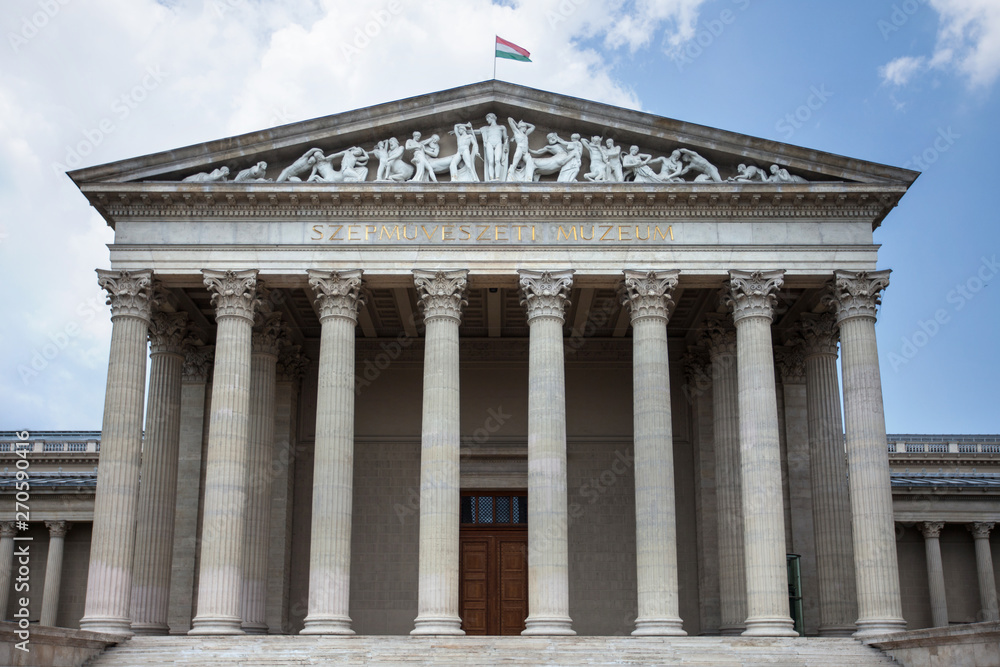 Budapest. Hungary. Museum building with columns on a background of blue sky