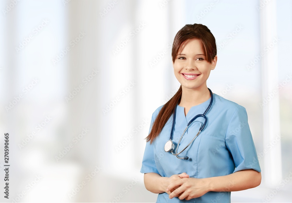 Male doctor with stethoscope on blurred hospital background Male doctor with stethoscope on blurred hospital background