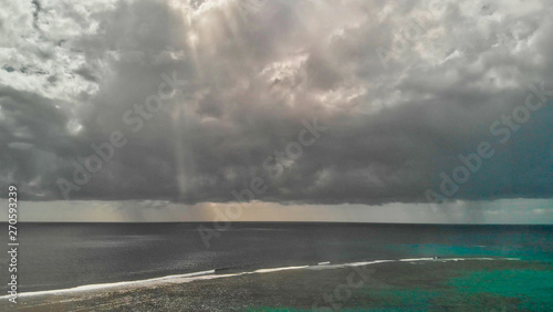 Aerial view of beauitful ocean with storm approaching