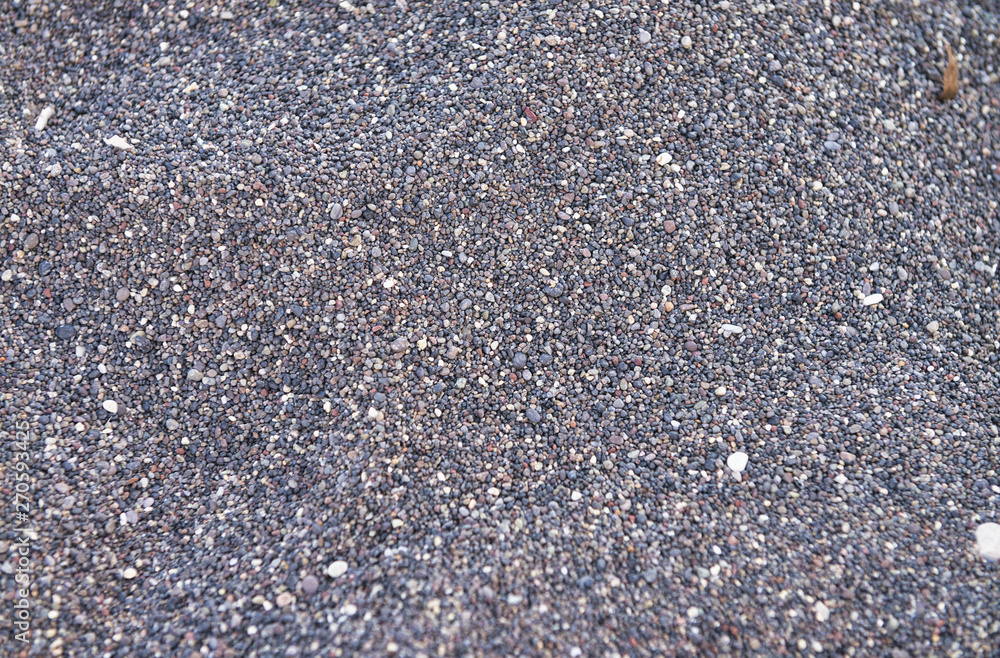 Volcanic beach of Santorini. Background and holiday concept Volcanic beach of Santorini. Background and holiday concept
