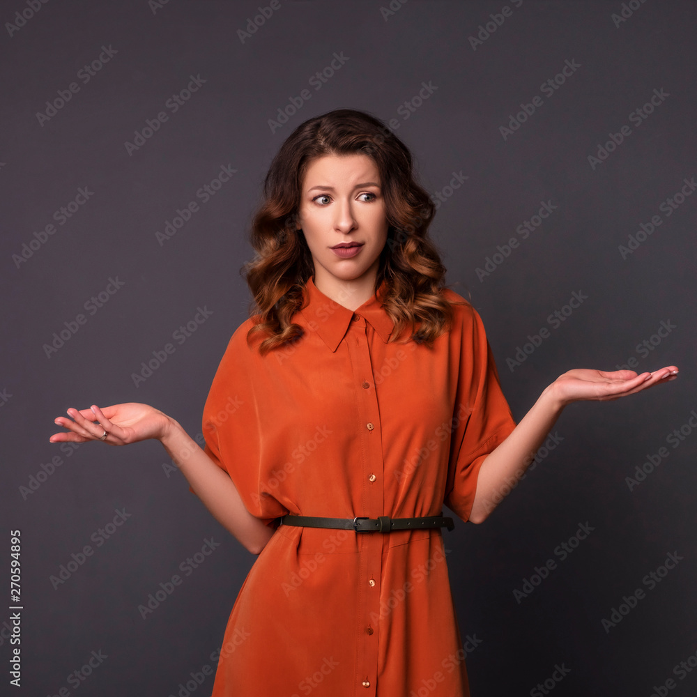 Brunette woman on a neutral background. Emotional portrait Brunette woman on a neutral background. Emotional portrait