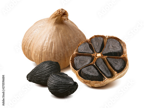 Black garlic cloves isolated on white background