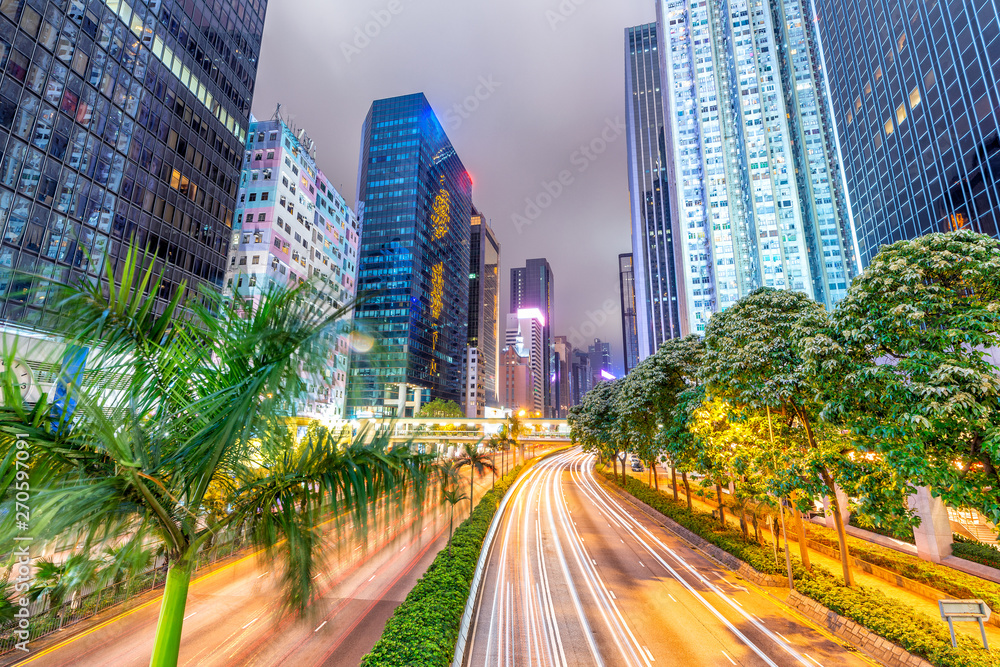 Fototapeta premium Hong Kong buildings and traffic. City skyline at night. Business concept