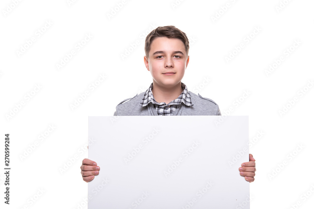 Close up of man showing white board. Guy teenager, student, schoolboy showing empty space white placard Close up of man showing white board. Guy teenager, student, schoolboy showing empty space white placard