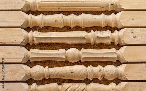 Obraz na plátně Wooden balusters of pine for the staircase railing.