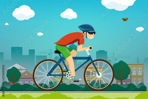 Man rides a bicycle on the road in the suburbs