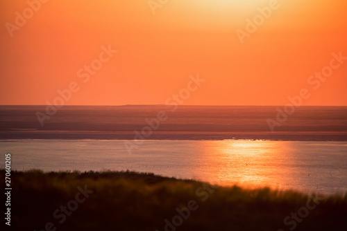 Beautiful landscape with sunset over saline lake Baskunchak