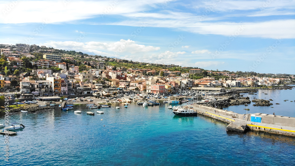 Acitrezza Sicily aerial scenic panorama of the town, the port, blue sea and beautiful sky