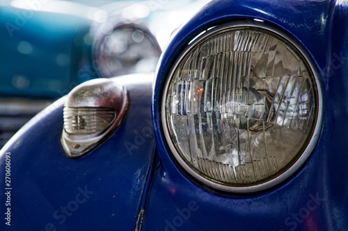 Headlight of antique old car, detail on the headlight of a vintage car. Selective focus