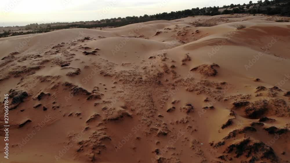 Desert sand dunes aerial drone flyover, Mui Ne, Vietnam. Desert sand dunes aerial drone flyover, Mui Ne, Vietnam.