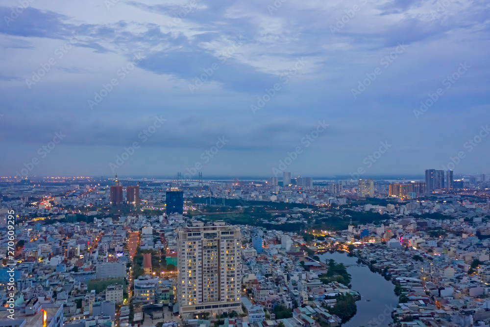 Naklejka premium High Density Suburban area at Twilight Aerial of SE Asian City