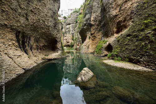 Steep cliffs at Guadalevin river at El Tajo Gorge from the bottom of the secret water mine in Ronda Spain