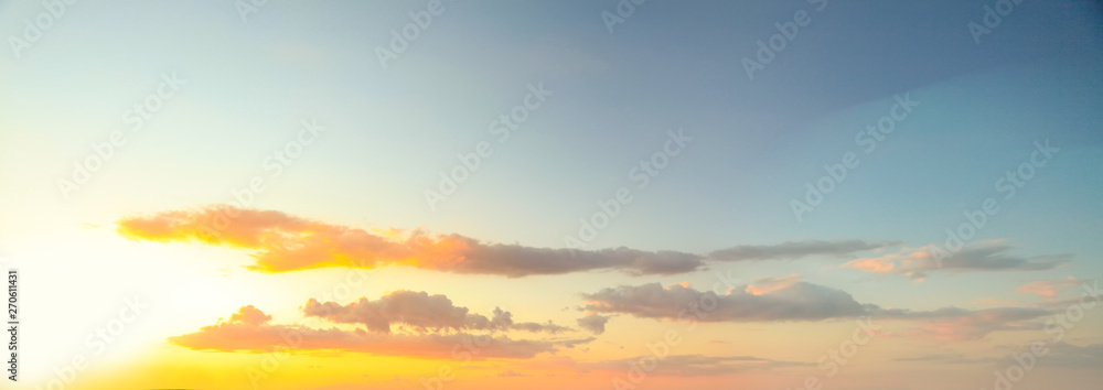 Blue sky clouds background. Beautiful landscape with clouds and sunset