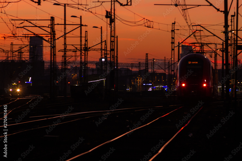Photo of railway infrastructure at sunset.