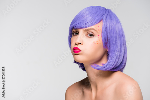beautiful naked girl in trendy purple wig isolated on grey
