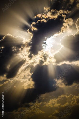 Light of the setting sun through the clouds photo