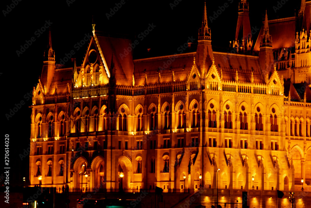 Fototapeta premium Budapest Hungary, 05.29.2019 Hungarian Parliament Building. night Budapest, glowing in gold. facade and roof of an old building