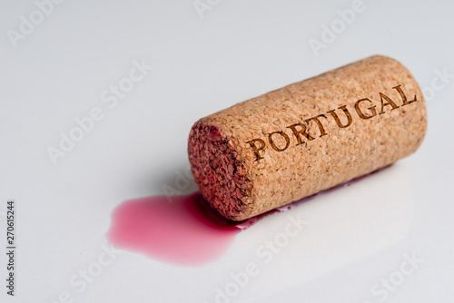 Wine cork isolated on the white. Recording the name of the Country Portugal.