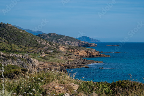 Spectacular landscapes, awe-inspiring cliffs, charming villages and historical landmarks along the coastal road between Alghero and Bossa, Sardinia, Italy. One of the most panoramic spots in Italy.