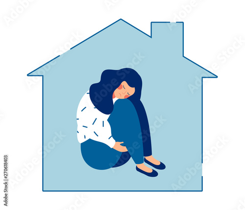Young sad woman sits alone at home  and hugging her knees. Teen girl unhappy in an orphanage without parents