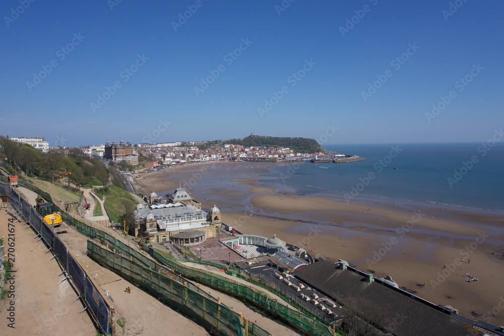 View from clifftops across the bay at Scarborough, Yorkshire, UK on a clear blue sky sunny day