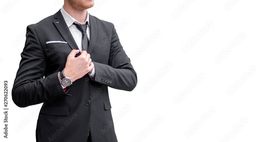 Confident young businessman looking away while standing outdoors with cityscape in the background Confident young businessman looking away while standing outdoors with cityscape in the background