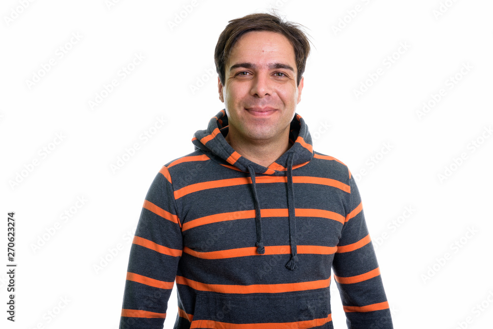 Studio shot of young Persian man with hoodie isolated against wh