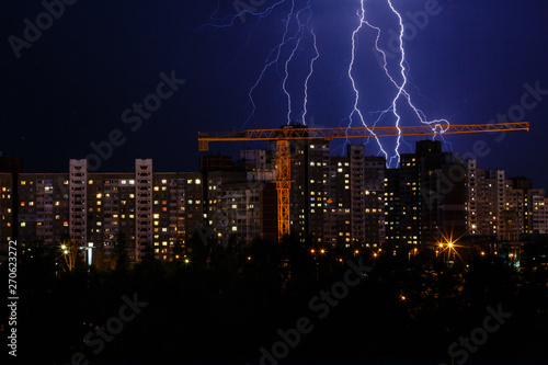 lightening bolts behind a city