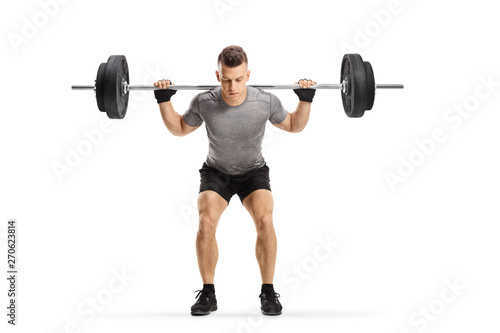 Fit guy lifting weights photo