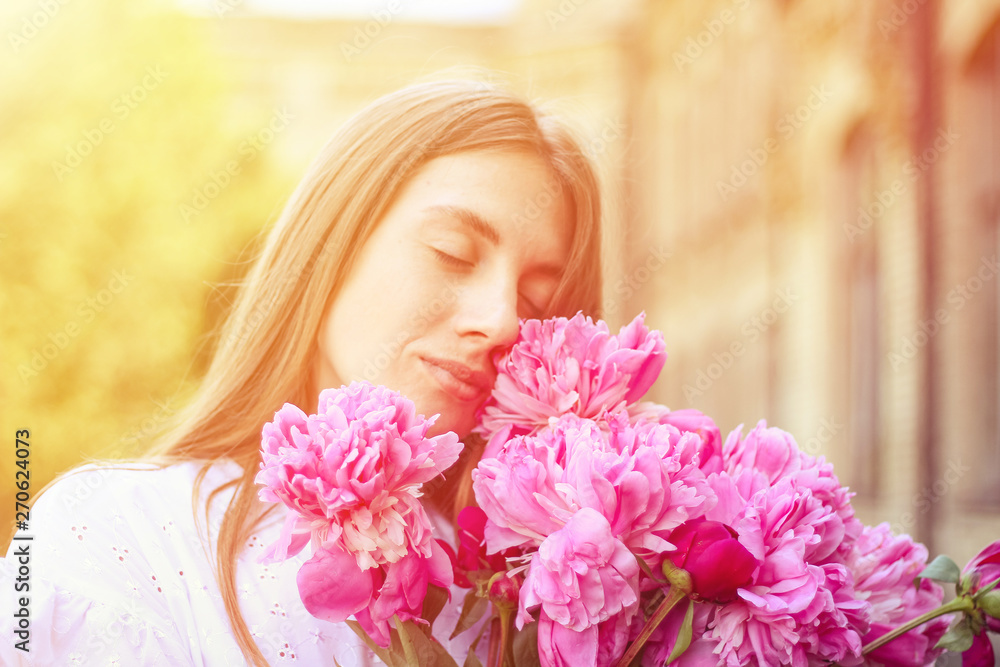 beautiful girl, no makeup, natural beauty, feminism. woman in a white dress, crosswise with a bouquet of peonies beautiful girl, no makeup, natural beauty, feminism. woman in a white dress, crosswise with a bouquet of peonies