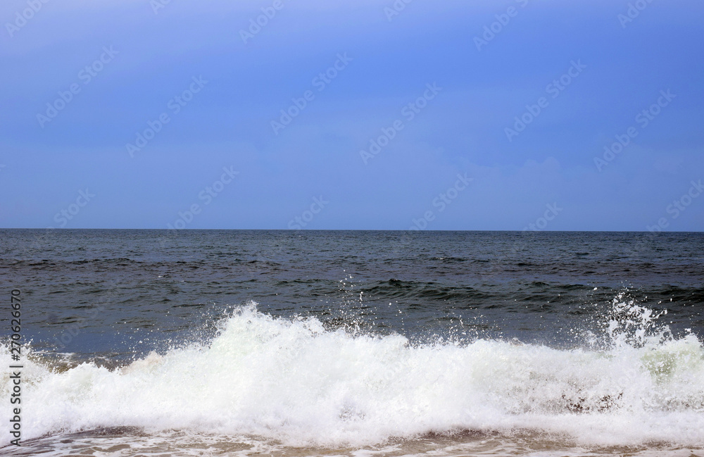 Sea view from tropical beach with sunny sky.  Exotic summer beach with clouds on horizon. Ocean beach relax, outdoor travel