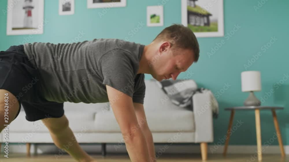 Young man are doing yoga at living room in the morning Young man are doing yoga at living room in the morning