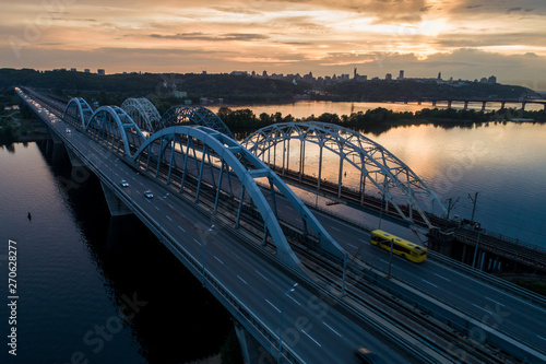 Sunset aerial view on a Darnitsky Bridge in Kyiv, Ukraine photo