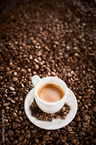 Vertical banner with espresso over coffee beans