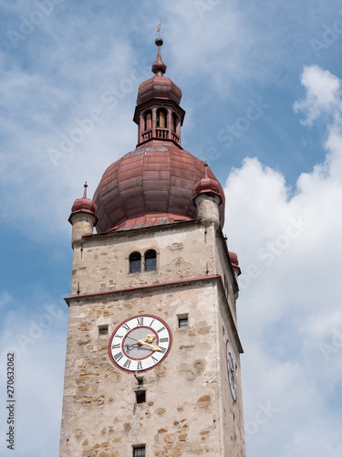 City Tower of Waidhofen an der Ybbs, called Stadtturm in German, with Stone Facade, Red Roof, Clock and Blue Sky photo