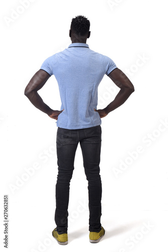 rear view of african man hands on waist on white background