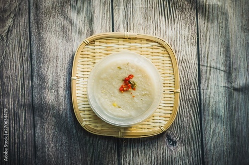 Bubur Lambuk, a popular Malaysian porridge which has been cooked with big pot and main ingredients are rice,meat,water and her usually during ramadhan, the fasting month  photo