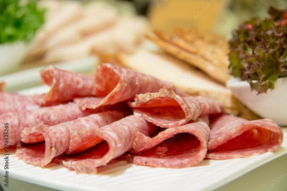  delicious slice salami on plate for buffet