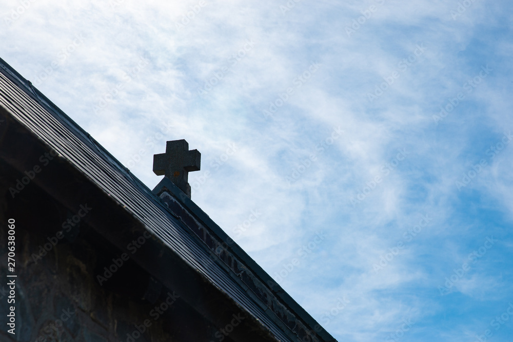 Christian cross religion symbol at the top roof church with beautiful blue sky background. Christian cross religion symbol at the top roof church with beautiful blue sky background.