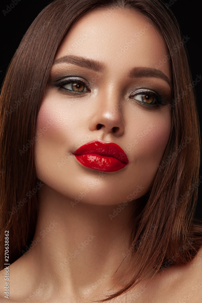 Beauty portrait of model with natural make-up. Fashion shiny highlighter on skin, sexy gloss lips make-up Beauty portrait of model with natural make-up. Fashion shiny highlighter on skin, sexy gloss lips make-up