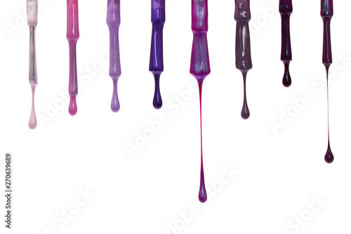 Nail varnish paint dripping on white background photo