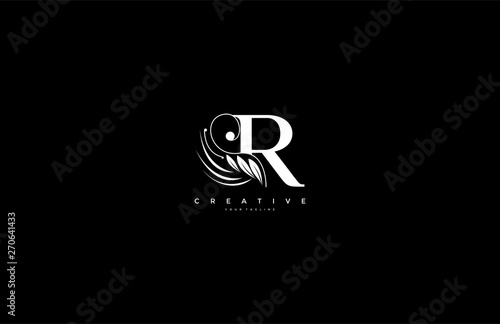 Initial R letter luxury beauty flourishes ornament monogram logo