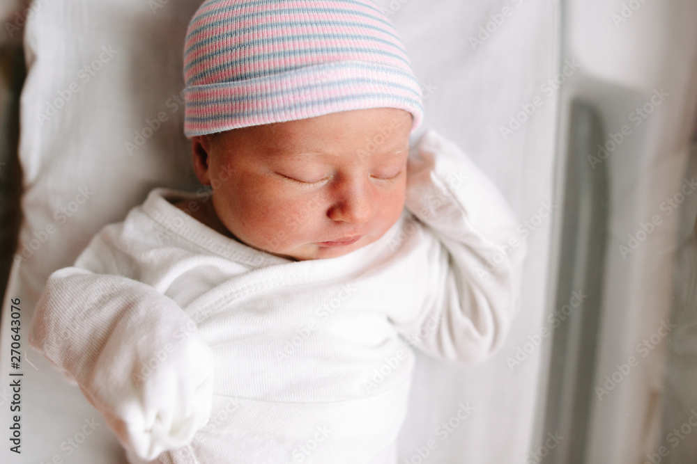 overhead view of baby in bassinet overhead view of baby in bassinet