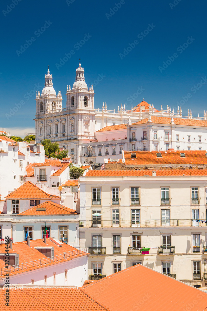 Aerial view of central Lisbon, Portugal, beautiful city panorama, old houses and monastery Igreja Sao Vicente de Fora on the hill
