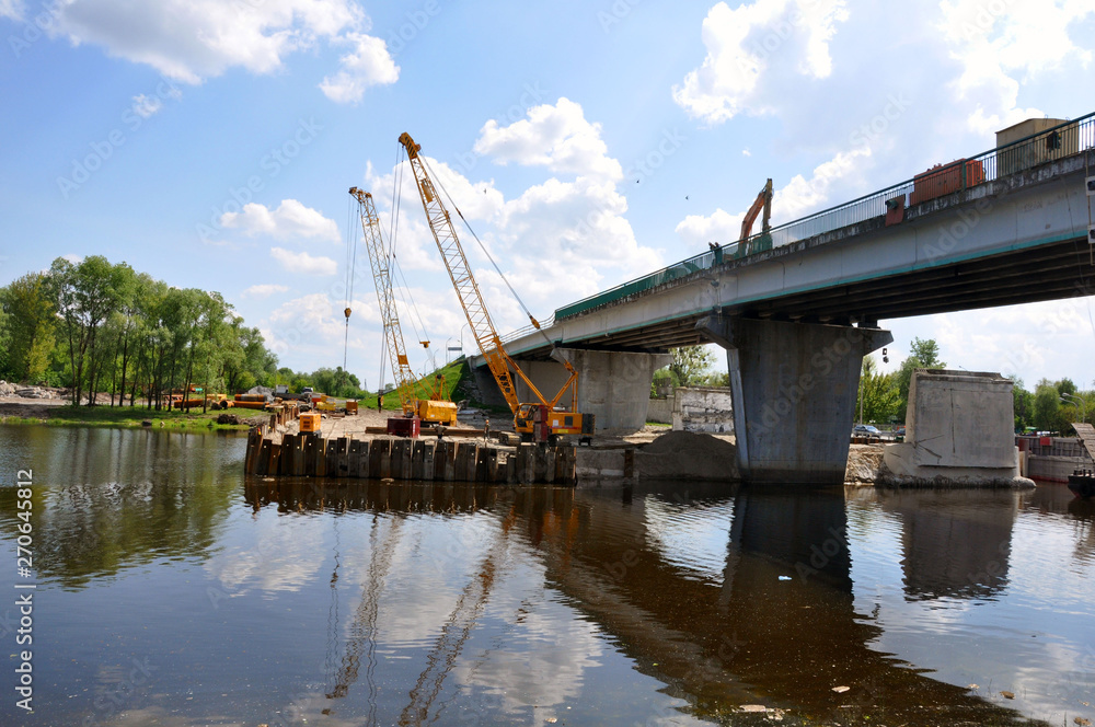 Repair of the bridge over the Pina River in Pinsk. Movement of cars in time