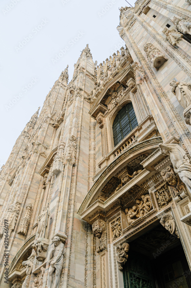Ornate carvings on the front of the Duomo Milano, Milan Cathedral, Italy