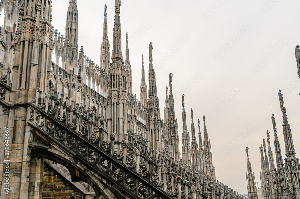 Ornately carved stonework on the roof of the Duomo Milano (Milan Cathedral), Italy