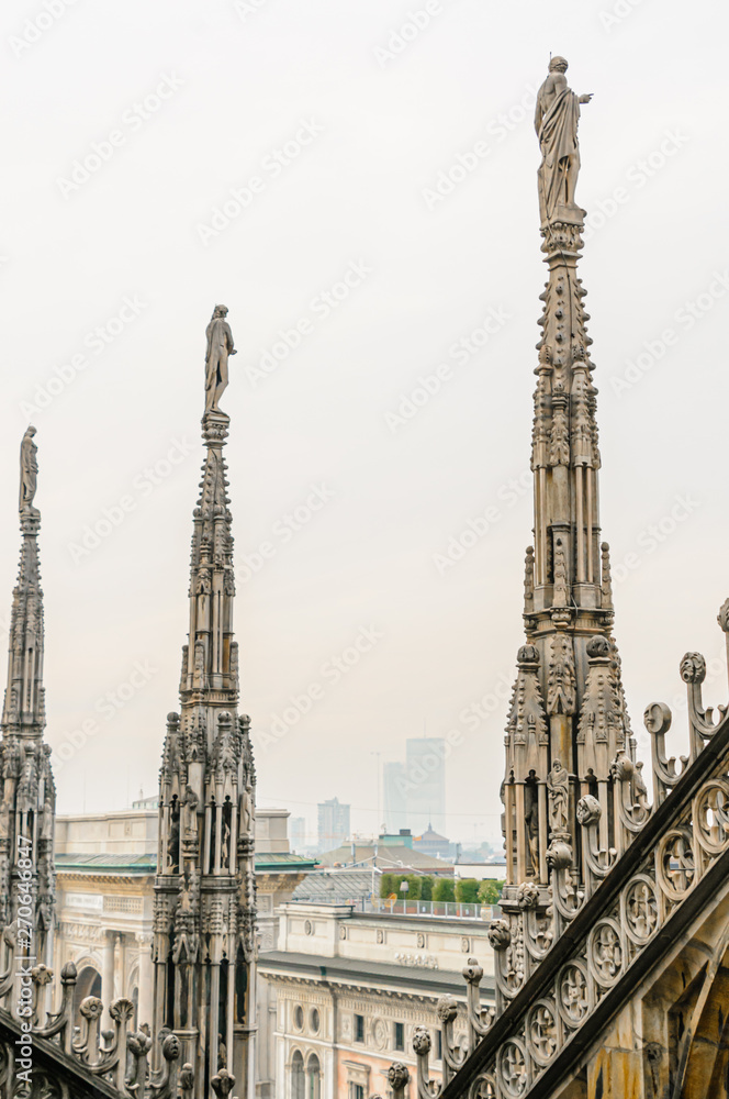Ornately carved stonework on the roof of the Duomo Milano (Milan Cathedral), Italy