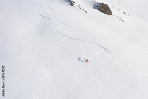 Offpiste skier in fresh powder snow photo