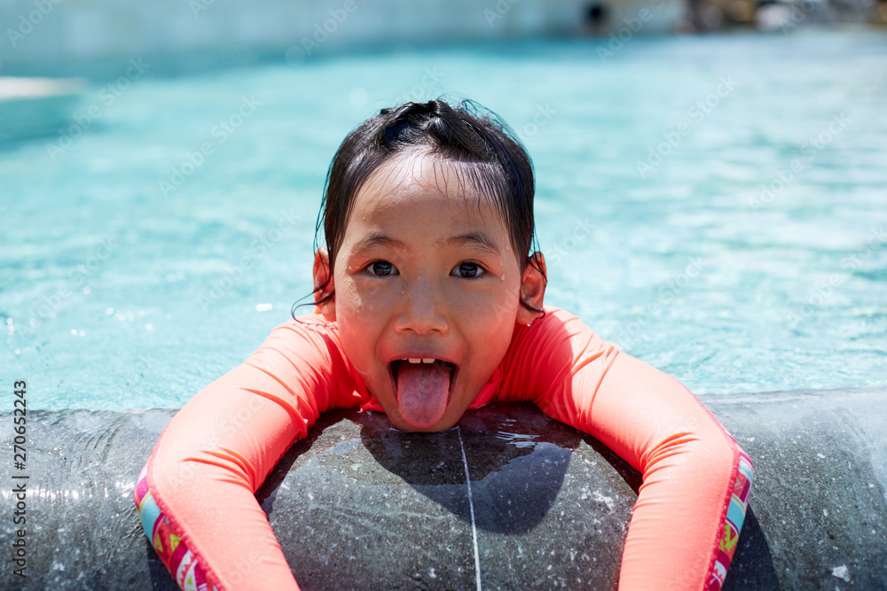 Cute asian little girl playing in the pool Stock Photo | Adobe Stock
